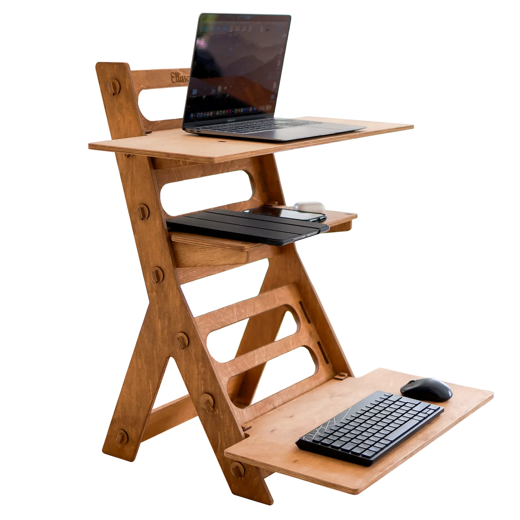 Wooden adjustable standing desk with laptop and keyboard on a white background
