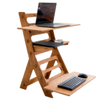 Wooden adjustable standing desk with laptop and keyboard on a white background